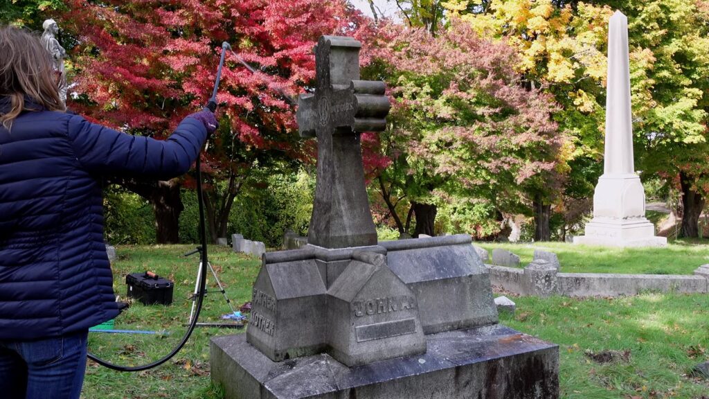 Spraying cleaner on the monument