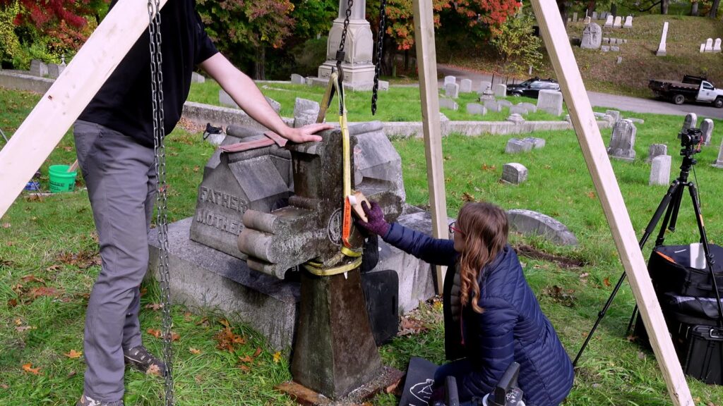 Strap and chain hoist resetting monument stones