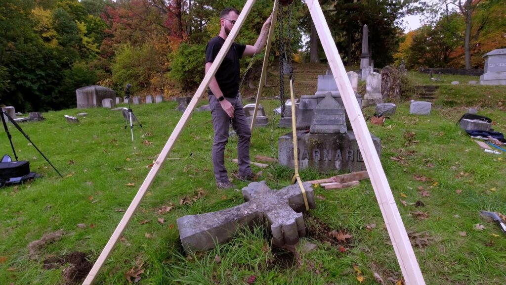 Wooden tripod with chain hoist over the fallen cross