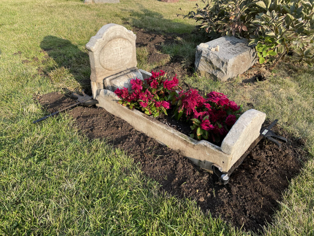 The rebuilt cradle grave planted with fresh flowers